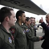 U.S. Secretary of Defense Chuck Hagel (R) gives a thumbs-up to the flight crew of a C-17 aircraft at the end of his quick visit to Ulaanbaat U.S. Secretary of Defense Chuck Hagel (R) gives a thumbs-up to the flight crew of a C-17 aircraft at the end of his quick visit to Ulaanbaat