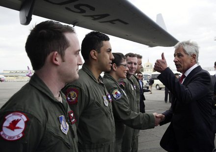 U.S. Secretary of Defense Chuck Hagel (R) gives a thumbs-up to the flight crew of a C-17 aircraft at the end of his quick visit to Ulaanbaat U.S. Secretary of Defense Chuck Hagel (R) gives a thumbs-up to the flight crew of a C-17 aircraft at the end of his quick visit to Ulaanbaat