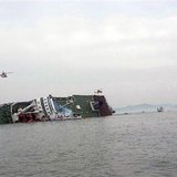 A South Korean passenger ship (C) that has been sinking, is seen at the sea off Jindo April 16, 2014. REUTERS/Yonhap A South Korean passenger ship (C) that has been sinking, is seen at the sea off Jindo April 16, 2014. REUTERS/Yonhap