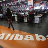 An employee walks past a logo of Alibaba Group at its headquarters on the outskirts of Hangzhou, Zhejiang province, in this May 17, 2010 fil An employee walks past a logo of Alibaba Group at its headquarters on the outskirts of Hangzhou, Zhejiang province, in this May 17, 2010 fil