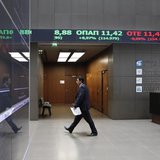 A man makes his way inside the reception hall of the Greek Stock Exchange in Athens April 10, 2014. REUTERS/Alkis Konstantinidis A man makes his way inside the reception hall of the Greek Stock Exchange in Athens April 10, 2014. REUTERS/Alkis Konstantinidis
