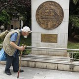 A man makes his way past a replica of a one drachma coin outside the Athens Town Hall May 21, 2012. REUTERS/Yorgos Karahalis A man makes his way past a replica of a one drachma coin outside the Athens Town Hall May 21, 2012. REUTERS/Yorgos Karahalis