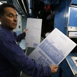 Printer Jose Lomeli holds newspaper printing plates for the first copies of the inaugural Los Angeles Register newspaper in Santa Ana, Calif Printer Jose Lomeli holds newspaper printing plates for the first copies of the inaugural Los Angeles Register newspaper in Santa Ana, Calif