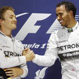 Mercedes Formula One driver Lewis Hamilton of Britain (R) is congratulated by teammate Mercedes Formula One driver Nico Rosberg of Germany o Mercedes Formula One driver Lewis Hamilton of Britain (R) is congratulated by teammate Mercedes Formula One driver Nico Rosberg of Germany o