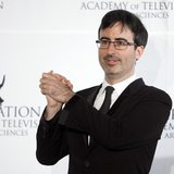 Comedian John Oliver poses for photographers backstage during the 41st International Emmy Awards in New York, November 25, 2013. REUTERS/Car Comedian John Oliver poses for photographers backstage during the 41st International Emmy Awards in New York, November 25, 2013. REUTERS/Car