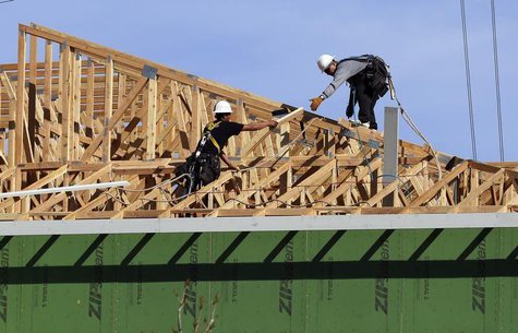 Workers install a roof on a multi-family building in Broomfield, Colorado February 19, 2014. REUTERS/Rick Wilking Workers install a roof on a multi-family building in Broomfield, Colorado February 19, 2014. REUTERS/Rick Wilking
