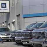 A man walks past a row of General Motors vehicles at a Chevrolet dealership on Woodward Avenue in Detroit, Michigan April 1, 2014. REUTERS/R A man walks past a row of General Motors vehicles at a Chevrolet dealership on Woodward Avenue in Detroit, Michigan April 1, 2014. REUTERS/R