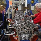 Ford assembly line employees work on 3500 Duramax engine as they move along the assembly line at the Ford Lima Engine Plant in Lima, Ohio, M Ford assembly line employees work on 3500 Duramax engine as they move along the assembly line at the Ford Lima Engine Plant in Lima, Ohio, M