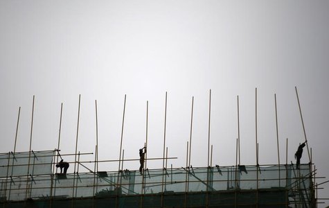 Labourers work at a construction site in Beijing, April 16, 2014. REUTERS/Kim Kyung-Hoon Labourers work at a construction site in Beijing, April 16, 2014. REUTERS/Kim Kyung-Hoon