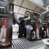 Employees pack boxes of the SodaStream product at the factory in the West Bank Jewish settlement of Maale Adumim January 28, 2014. REUTERS/A Employees pack boxes of the SodaStream product at the factory in the West Bank Jewish settlement of Maale Adumim January 28, 2014. REUTERS/A