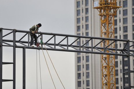 A labourer works at a construction site in Hefei, Anhui province, April 15, 2014. REUTERS/Stringer A labourer works at a construction site in Hefei, Anhui province, April 15, 2014. REUTERS/Stringer