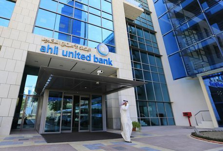 A customer walks out from the main entrance to Ahli United Bank's headquarters in Manama October 30, 2013. REUTERS/Hamad I Mohammed A customer walks out from the main entrance to Ahli United Bank's headquarters in Manama October 30, 2013. REUTERS/Hamad I Mohammed