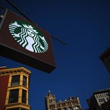 The sign of a Starbucks store is seen in New York January 24, 2014. REUTERS/Eric Thayer The sign of a Starbucks store is seen in New York January 24, 2014. REUTERS/Eric Thayer