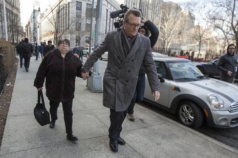 Annette Bongiorno (L), former portfolio manager for Bernard L. Madoff Investment Securities LLC, exits the Manhattan Federal Court house in Annette Bongiorno (L), former portfolio manager for Bernard L. Madoff Investment Securities LLC, exits the Manhattan Federal Court house in