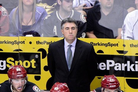 Oct 22, 2013; Glendale, AZ, USA; Phoenix Coyotes head coach Dave Tippett looks on during the third period against the Calgary Flames at Jobi Oct 22, 2013; Glendale, AZ, USA; Phoenix Coyotes head coach Dave Tippett looks on during the third period against the Calgary Flames at Jobi