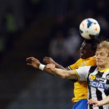 Juventus' Kwadwo Asamoah (L) jumps for the ball with Udinese's Dusan Basta during their Italian Serie A soccer match at the Friuli stadium i Juventus' Kwadwo Asamoah (L) jumps for the ball with Udinese's Dusan Basta during their Italian Serie A soccer match at the Friuli stadium i