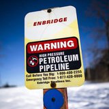 A sign warning of a high pressure petroleum pipeline is seen on the "Line 9" Enbridge oil pipeline route in East Don Parkland in Toronto, Ma A sign warning of a high pressure petroleum pipeline is seen on the "Line 9" Enbridge oil pipeline route in East Don Parkland in Toronto, Ma