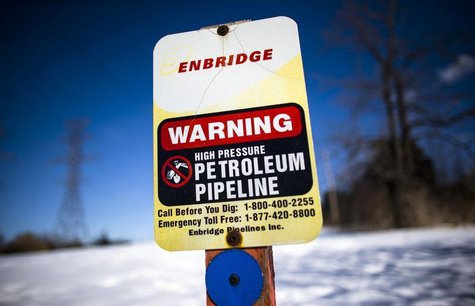 A sign warning of a high pressure petroleum pipeline is seen on the "Line 9" Enbridge oil pipeline route in East Don Parkland in Toronto, Ma A sign warning of a high pressure petroleum pipeline is seen on the "Line 9" Enbridge oil pipeline route in East Don Parkland in Toronto, Ma