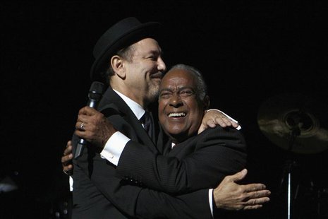 Puerto Rican salsa singer Jose "Cheo" Feliciano (R) embraces Panamanian singer Ruben Blades during Blades' initial concert of his new tour " Puerto Rican salsa singer Jose "Cheo" Feliciano (R) embraces Panamanian singer Ruben Blades during Blades' initial concert of his new tour "