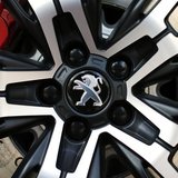 A Peugeot logo is seen on a car which is displayed at PSA Peugeot Citroen headquarters in Paris April 14, 2014. REUTERS/Benoit Tessier A Peugeot logo is seen on a car which is displayed at PSA Peugeot Citroen headquarters in Paris April 14, 2014. REUTERS/Benoit Tessier