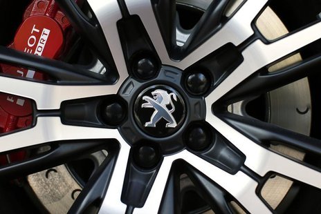 A Peugeot logo is seen on a car which is displayed at PSA Peugeot Citroen headquarters in Paris April 14, 2014. REUTERS/Benoit Tessier A Peugeot logo is seen on a car which is displayed at PSA Peugeot Citroen headquarters in Paris April 14, 2014. REUTERS/Benoit Tessier
