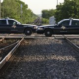 Texas State Troopers block a railway line leading towards a fertilizer plant explosion in the town of West, near Waco, Texas April 20, 2013. Texas State Troopers block a railway line leading towards a fertilizer plant explosion in the town of West, near Waco, Texas April 20, 2013.