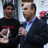 Kassim Alhimidi (R) speaks next to his son Mohammed Alhimidi (L) during a candlelight vigil to remember his wife Shaima Alawadi outside thei Kassim Alhimidi (R) speaks next to his son Mohammed Alhimidi (L) during a candlelight vigil to remember his wife Shaima Alawadi outside thei