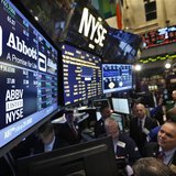 Traders gather at the booth that trades Abbott Laboratories on the floor of the New York Stock Exchange in this file photo taken December 10 Traders gather at the booth that trades Abbott Laboratories on the floor of the New York Stock Exchange in this file photo taken December 10