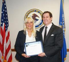 Sheboygan Police Detective Tamara Remington poses with DOJ Attorney James Santelle with her recognition. Sheboygan Police Detective Tamara Remington poses with DOJ Attorney James Santelle with her recognition.