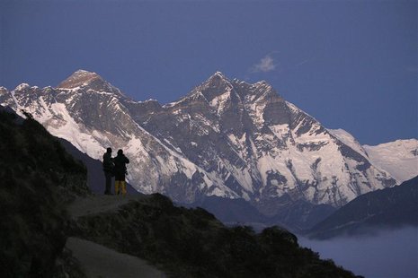 Travellers enjoy a view of Mount Everest at Syangboche in Nepal, in this December 3, 2009 file photograph. REUTERS/Gopal Chitrakar/Files Travellers enjoy a view of Mount Everest at Syangboche in Nepal, in this December 3, 2009 file photograph. REUTERS/Gopal Chitrakar/Files