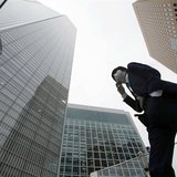 A businessman walks in Tokyo's business district April 18, 2014. REUTERS/Toru Hanai A businessman walks in Tokyo's business district April 18, 2014. REUTERS/Toru Hanai