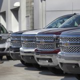 A man walks past a row of General Motors vehicles at a Chevrolet dealership on Woodward Avenue in Detroit, Michigan April 1, 2014. REUTERS/R A man walks past a row of General Motors vehicles at a Chevrolet dealership on Woodward Avenue in Detroit, Michigan April 1, 2014. REUTERS/R