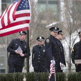Police officers from around the state of Massachusetts gather near a makeshift memorial for slain Massachusetts Institute of Technology poli Police officers from around the state of Massachusetts gather near a makeshift memorial for slain Massachusetts Institute of Technology poli
