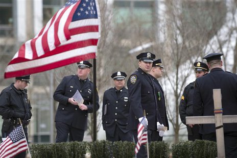 Police officers from around the state of Massachusetts gather near a makeshift memorial for slain Massachusetts Institute of Technology poli Police officers from around the state of Massachusetts gather near a makeshift memorial for slain Massachusetts Institute of Technology poli