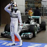 Mercedes Formula One driver Lewis Hamilton of Britain gestures while celebrating after taking pole position at the qualifying session of the Mercedes Formula One driver Lewis Hamilton of Britain gestures while celebrating after taking pole position at the qualifying session of the