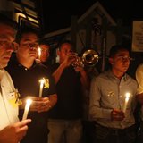 Residents hold lighted candles as they pay homage in front of the house of Colombian Nobel Prize laureate Gabriel Garcia Marquez in Aracatac Residents hold lighted candles as they pay homage in front of the house of Colombian Nobel Prize laureate Gabriel Garcia Marquez in Aracatac