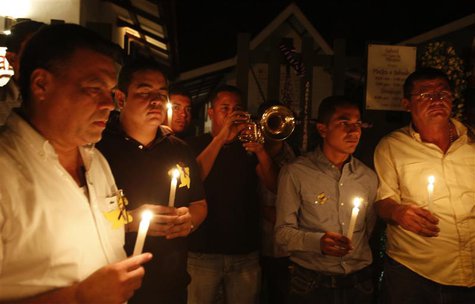 Residents hold lighted candles as they pay homage in front of the house of Colombian Nobel Prize laureate Gabriel Garcia Marquez in Aracatac Residents hold lighted candles as they pay homage in front of the house of Colombian Nobel Prize laureate Gabriel Garcia Marquez in Aracatac