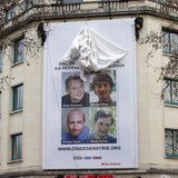 A poster calling for the release of French journalists Didier Francois, Edouard Elias, Nicolas Henin and Pierre Torres is installed on the f A poster calling for the release of French journalists Didier Francois, Edouard Elias, Nicolas Henin and Pierre Torres is installed on the f