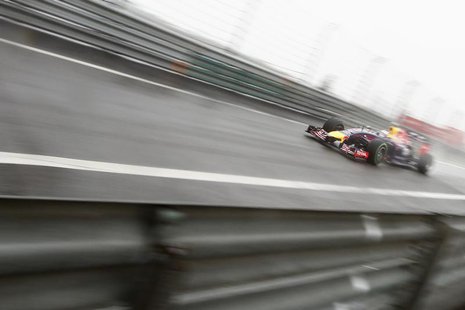 Red Bull Racing Formula One driver Sebastian Vettel of Germany drives during the qualifying session for the Chinese F1 Grand Prix at the Sha Red Bull Racing Formula One driver Sebastian Vettel of Germany drives during the qualifying session for the Chinese F1 Grand Prix at the Sha