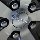 The Jeep logo is seen on the wheel of a Jeep Grand Cherokee on the showroom at the Massey-Yardley Chrysler, Dodge, Jeep and Ram automobile d The Jeep logo is seen on the wheel of a Jeep Grand Cherokee on the showroom at the Massey-Yardley Chrysler, Dodge, Jeep and Ram automobile d