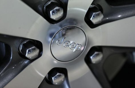 The Jeep logo is seen on the wheel of a Jeep Grand Cherokee on the showroom at the Massey-Yardley Chrysler, Dodge, Jeep and Ram automobile d The Jeep logo is seen on the wheel of a Jeep Grand Cherokee on the showroom at the Massey-Yardley Chrysler, Dodge, Jeep and Ram automobile d