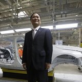 Chairman of Zhejiang Geely Holding Group Li Shufu poses for a photo at an assembly line of the new Volvo automobile manufacturing plant in C Chairman of Zhejiang Geely Holding Group Li Shufu poses for a photo at an assembly line of the new Volvo automobile manufacturing plant in C