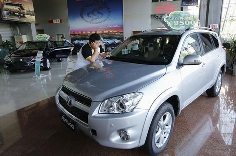 A man uses a mobile phone at a showroom of Toyota Motor in Beijing July 2, 2013. REUTERS/Kim Kyung-Hoon A man uses a mobile phone at a showroom of Toyota Motor in Beijing July 2, 2013. REUTERS/Kim Kyung-Hoon