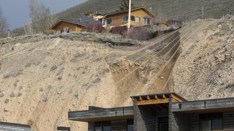 A ridge top home is split in pieces as a slow-moving landslide threatens several houses and businesses in Jackson Hole, Wyoming April 18, 20 A ridge top home is split in pieces as a slow-moving landslide threatens several houses and businesses in Jackson Hole, Wyoming April 18, 20