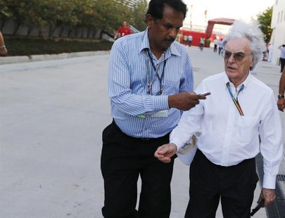 Formula One commercial supremo Bernie Ecclestone's hair blows in the wind while being interviewed as he walks at the paddock after the third Formula One commercial supremo Bernie Ecclestone's hair blows in the wind while being interviewed as he walks at the paddock after the third