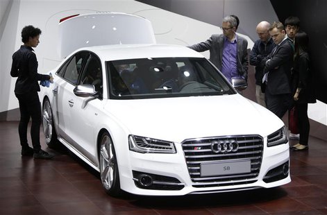 Visitors look at an Audi S8 car at Auto China 2014 in Beijing April 20, 2014. REUTERS/Jason Lee Visitors look at an Audi S8 car at Auto China 2014 in Beijing April 20, 2014. REUTERS/Jason Lee