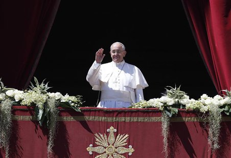 Pope Francis waves as he arrives to deliver the Urbi et Orbi (to the city and the world) benediction at the end of the Easter Mass in Saint Pope Francis waves as he arrives to deliver the Urbi et Orbi (to the city and the world) benediction at the end of the Easter Mass in Saint