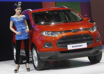 A model poses beside a Ford Ecosport during a media presentation of the 34th Bangkok International Motor Show in Bangkok March 26, 2013. REU A model poses beside a Ford Ecosport during a media presentation of the 34th Bangkok International Motor Show in Bangkok March 26, 2013. REU
