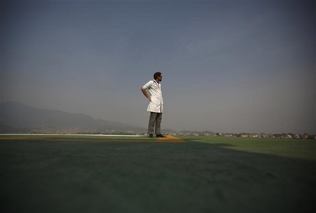 A doctor expecting the arrival of the victims of a Mount Everest avalanche standbys near the helipad at Grandi International Hospital in Kat A doctor expecting the arrival of the victims of a Mount Everest avalanche standbys near the helipad at Grandi International Hospital in Kat