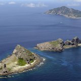 A group of disputed islands, Uotsuri island (top), Minamikojima (bottom) and Kitakojima, known as Senkaku in Japan and Diaoyu in China is se A group of disputed islands, Uotsuri island (top), Minamikojima (bottom) and Kitakojima, known as Senkaku in Japan and Diaoyu in China is se